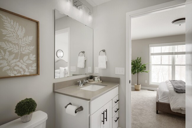 Convenience and privacy with this ensuite bath - Villages of Island Park