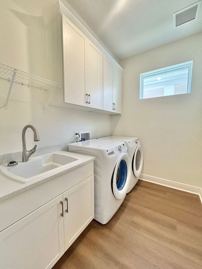 Building Photo - Gorgeous 4/3 Residence with a Private Back Lanai and a 3 Car Garage in the Delightful Laureate Pa...