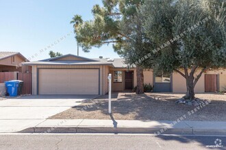 Building Photo - REMODELED 3 BEDROOM HOME W WOOD FLOORING I...