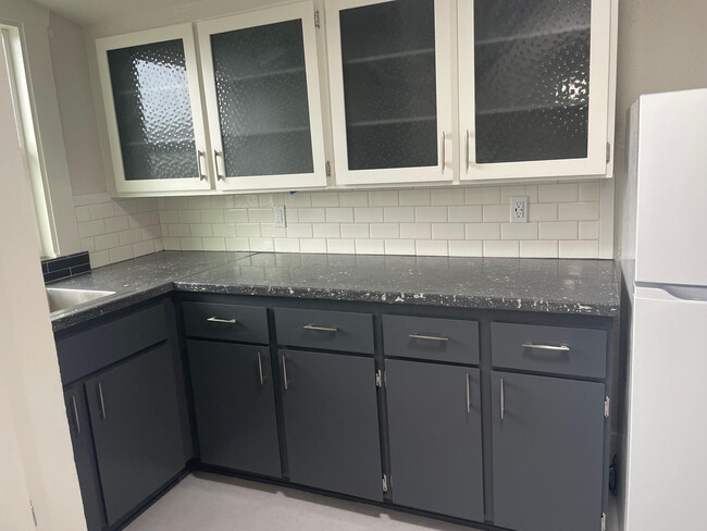 Kitchen with custom cabinets and concrete countertop - 1111 NW 58th St