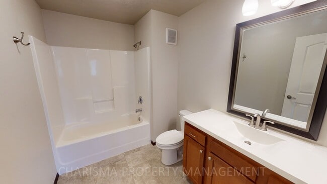 Building Photo - LOWER LEVEL 3 BEDROOM, 2 BATH TOWN HOME, INDIVIDUAL ENTRANCE, DOUBLE ATTACHED GARAGE, PET FRIENDLY