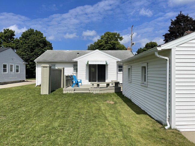 Back Deck with outdoor seating - 644 3 Mile Rd NE