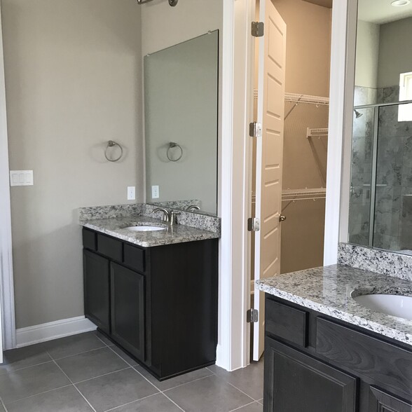 Master bathroom his and her vanity with walk in closet - 3750 E Palm Valley Blvd