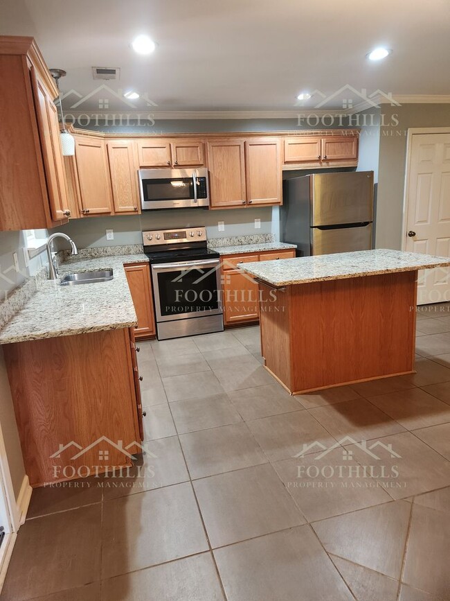 Building Photo - Beautiful 3-Bedroom Brick Home with Sunroo...