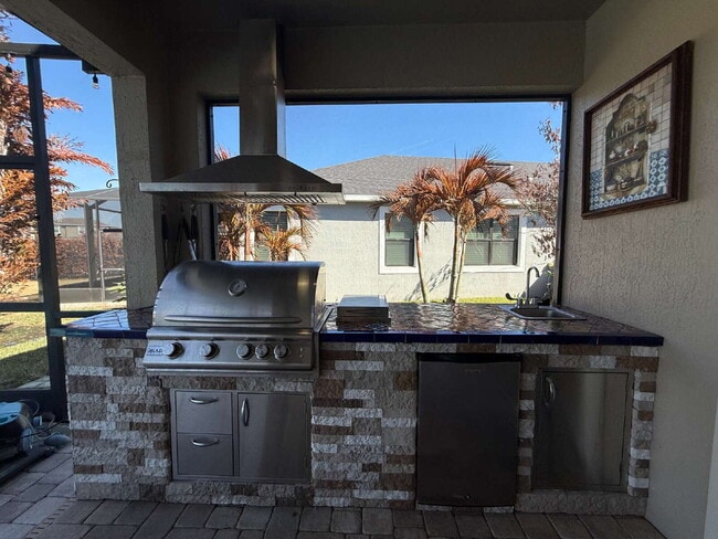 Building Photo - 4BR, 2.5BA home with resort style outdoor living!