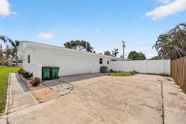 Building Photo - Welcome to this beautifully remodeled 4-bedroom, 3-bath home in the heart of Indialantic Beach!