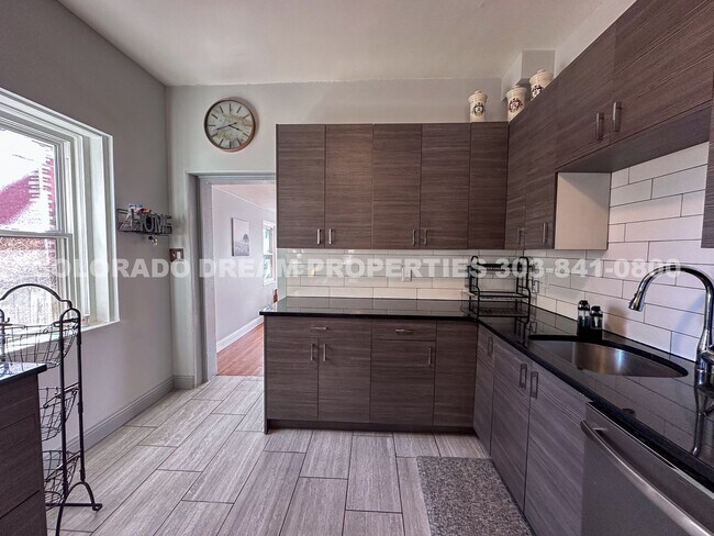 Building Photo - A home where old-world charm meets modern sophistication!