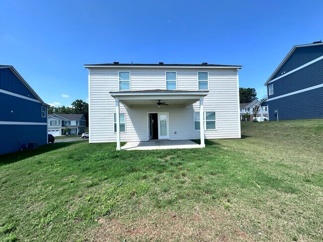 Building Photo - efficient two-level home provides a large living room, 4 very spacious bedrooms, and 2.5 bathrooms