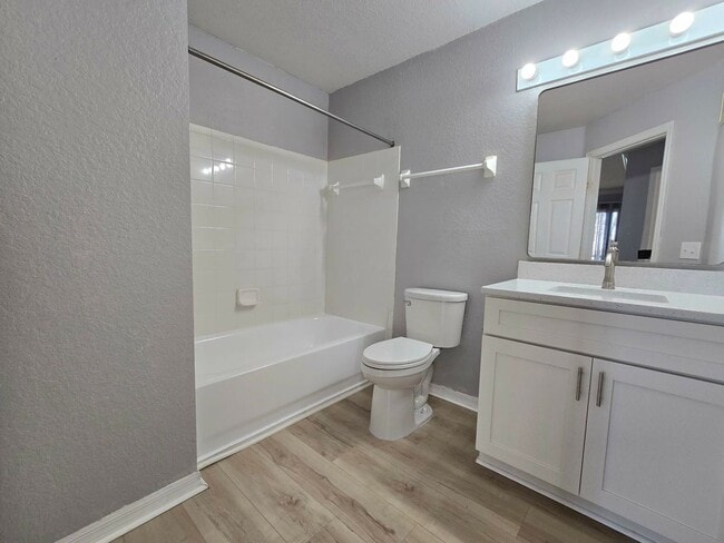 Building Photo - Beautiful 2BR/2BA Condo in Sunset Lakes – Lake & Tree Views!