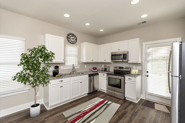 Building Photo - One level home with GARAGE and FENCED BACKYARD!