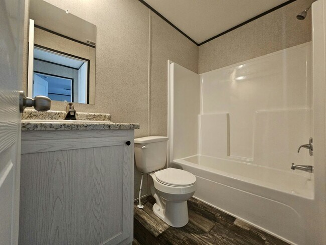 Building Photo - 6571 Hidden Oaks Dr