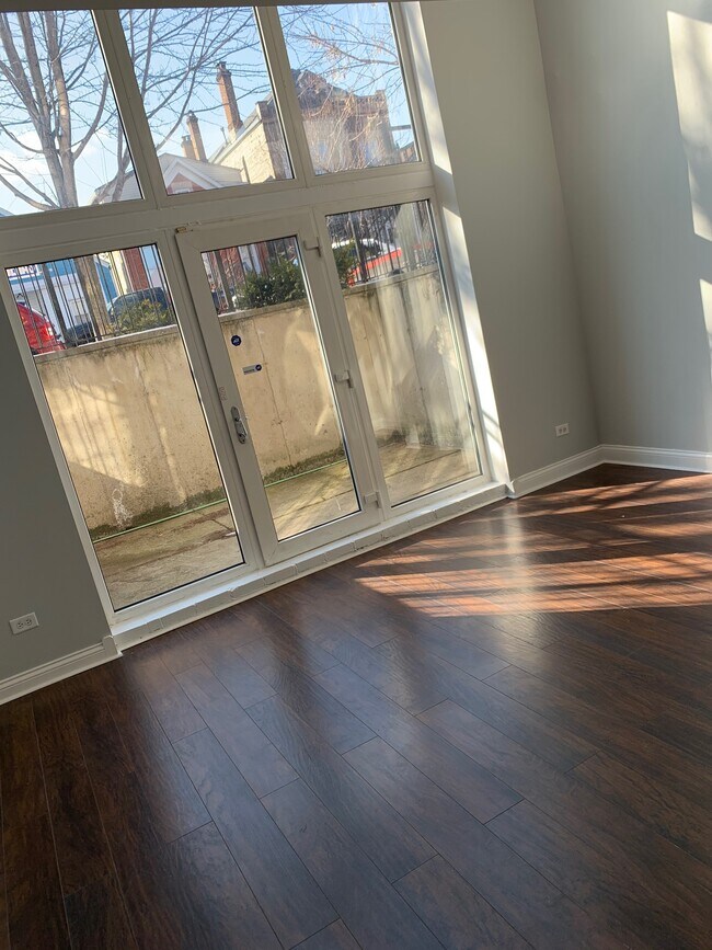 lower level living room w/ patio - 2327 S Sawyer Ave