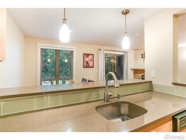 Kitchen, Living Room and Dining Rooms all look out to a lovely green space - 15140 NE 82nd St