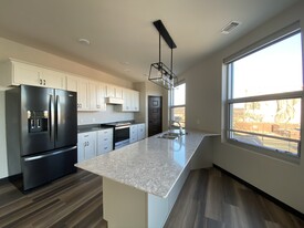 Fully equipped kitchen with Cambria countertops - Brennan Properties of Minnesota LLC