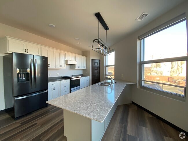 Fully equipped kitchen with Cambria countertops - Brennan Properties of Minnesota LLC