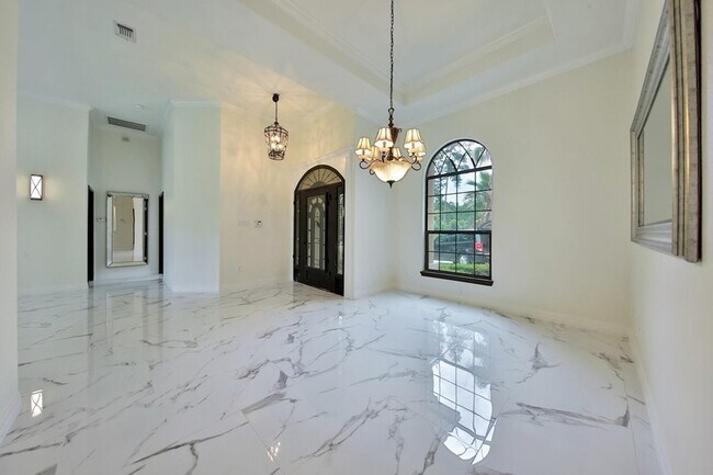 Building Photo - Beautiful Mediterranean Home In Gated Comm...