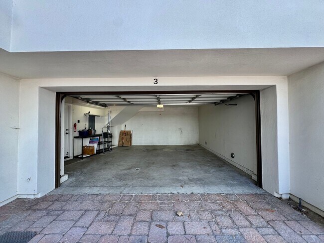 Building Photo - Beautifully Remodel Townhouse with AC & Two Car Garage!