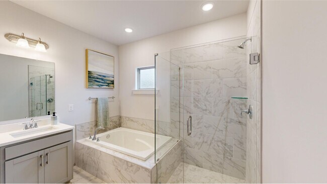 The en-suite bathroom boasts a luxurious & elegant dual-sink vanity - 15580 Ruthie Lynn Dr