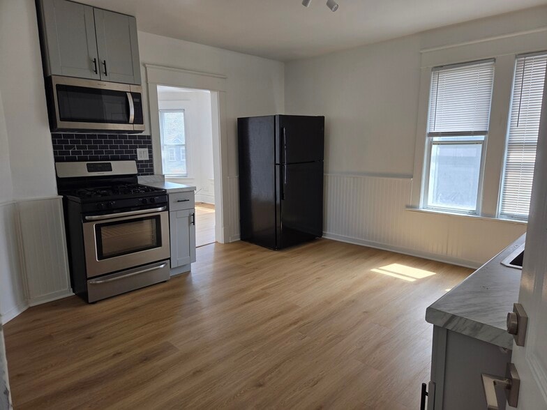 Kitchen with Stove and Microwave - 5706 22nd Ave