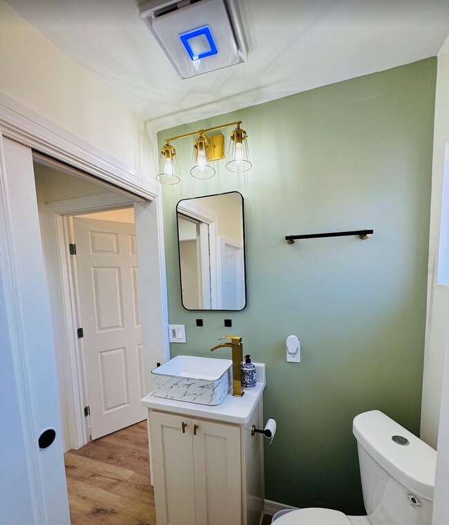 Hallway full bathroom with walk-in shower and built-in vanity cabinet - 807 N Lincoln St