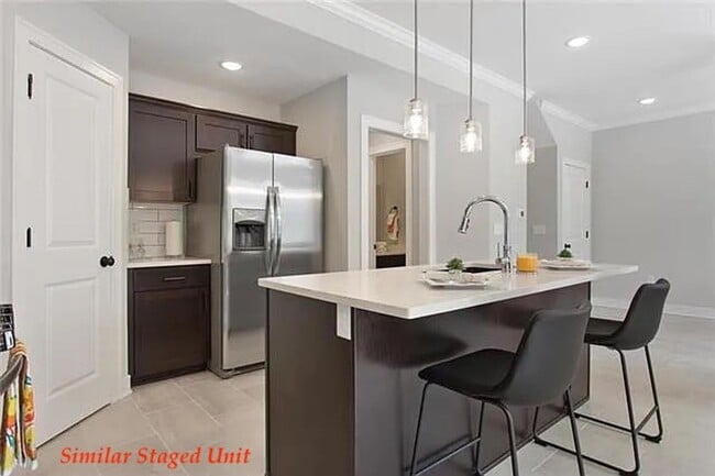 Building Photo - Stunning and Bright 3BR 2.5BA Townhome w/ 2-Car Garage • Quartzite Kitchen • Deck in Parkville