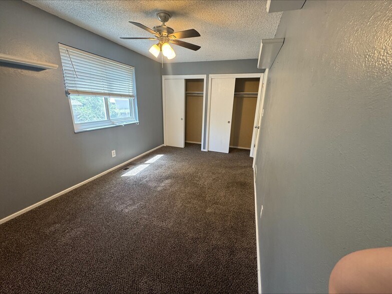 upstairs 2nd bedroom with double closets - 5879 S Oak St