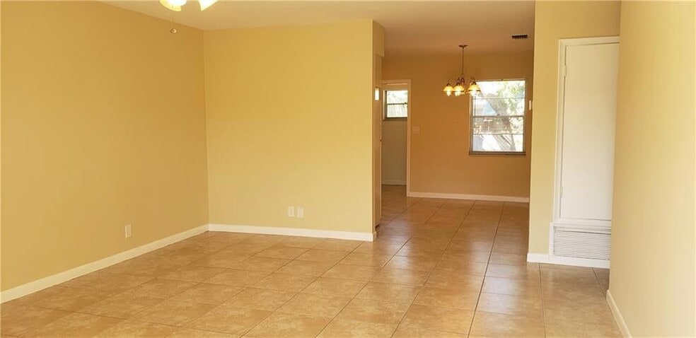 Bright living room with tile flooring - 981 NE 36th St