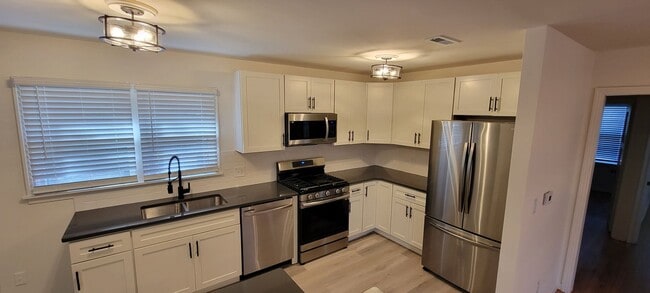 Building Photo - Tiehen Realty - Booth