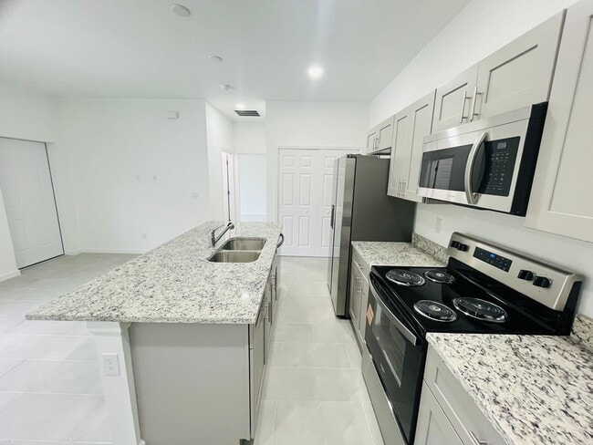 Building Photo - BRAND NEW CONSTRUCTION- ONE OF A KIND-ONE BEDROOM, ONE BATH-ONE CAR GARAGE- LEHIGH ACRES