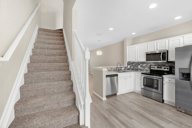 Building Photo - **NEWLY REMODELED ** MAINTENANCE FREE TOWN...