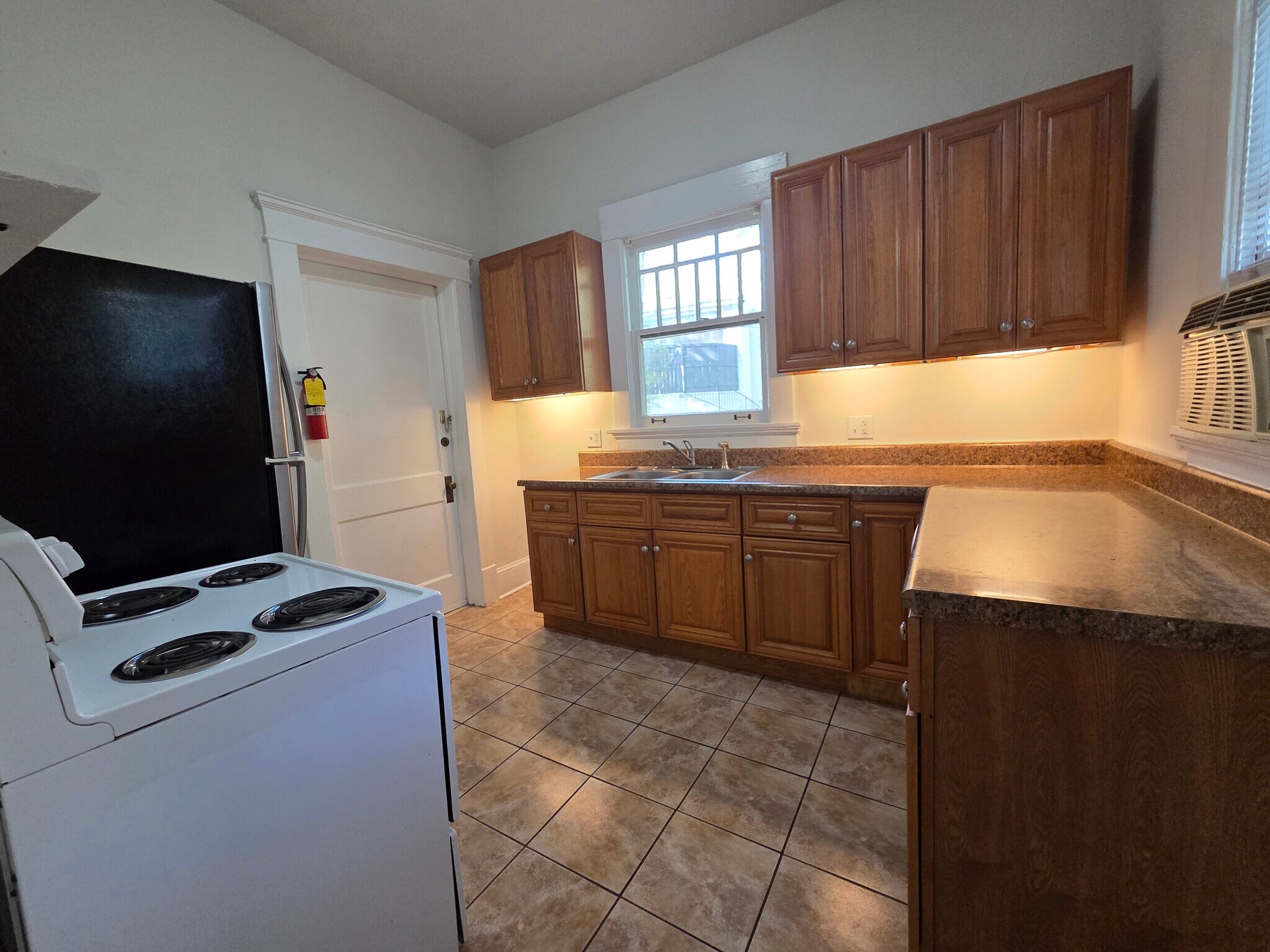 Kitchen with lots of cabinets and countertops - 974 N Highland Ave NE