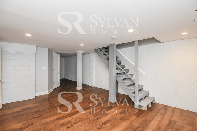 Building Photo - Welcome to this charming abode.