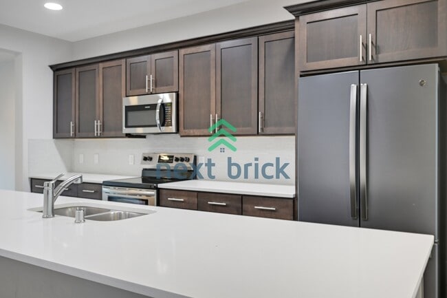 Building Photo - A Beautiful Corner Home Designed for Comfort, Light & Community!