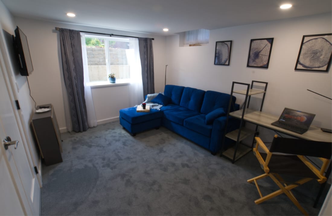 Sunny parlor. Notice work desk and fold-down table under TV - 4157 SE Brooklyn St