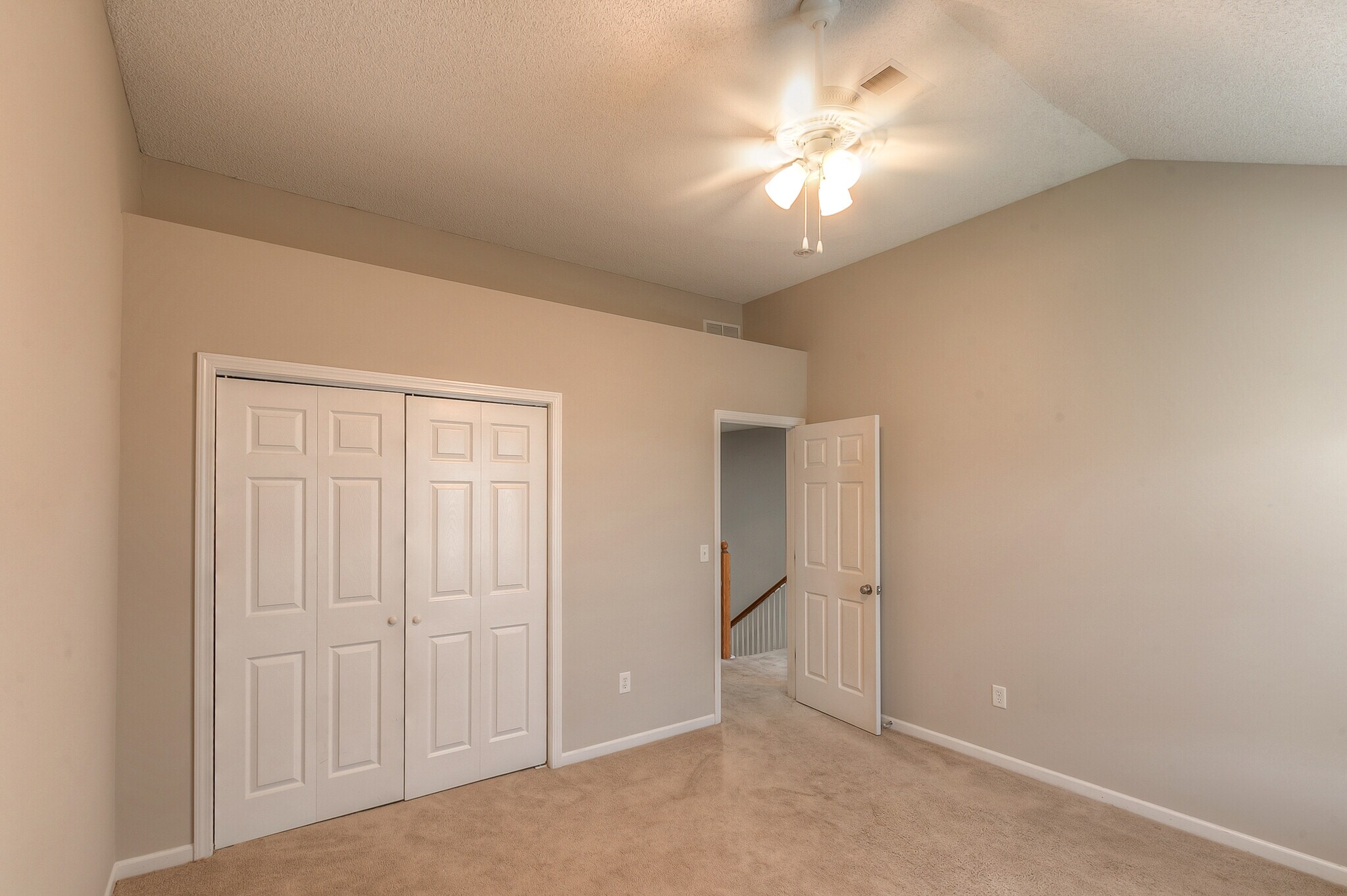 3rd bedroom with vault, ceiling fan, and big closet. - 22810 West 71st Terrace