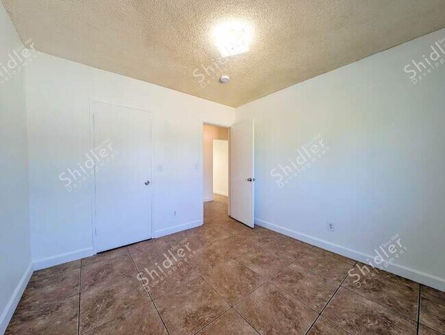 Building Photo - Upstairs 2 Bedroom 1 Bath with Massive Walk In Closet, Covered Gated Parking