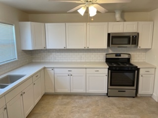 New stove & oven, and cabinets and counters. - 3731 46th St