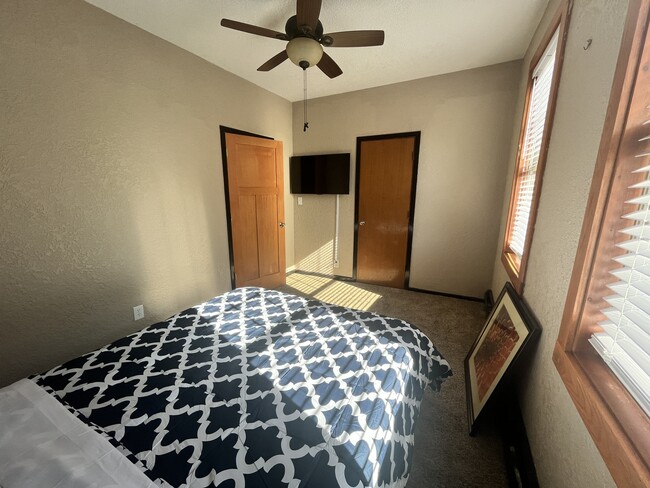 Bedroom #2 and the 43" smart TV, closet and door leading to hallway (closet closed) - 3517 19th Ave S