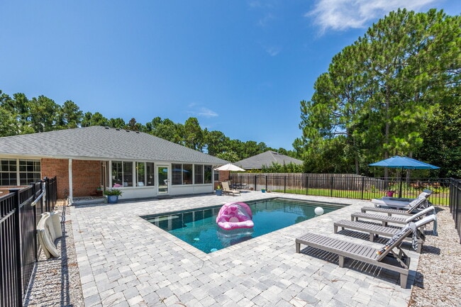 Building Photo - "Coastal Elegance Awaits: Spacious 4-Bed Oasis with $400.00 Off First Full Months Rent!"