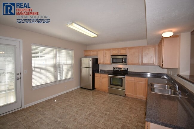 Building Photo - Adorable End Unit 2 bd Townhome with lawnc...