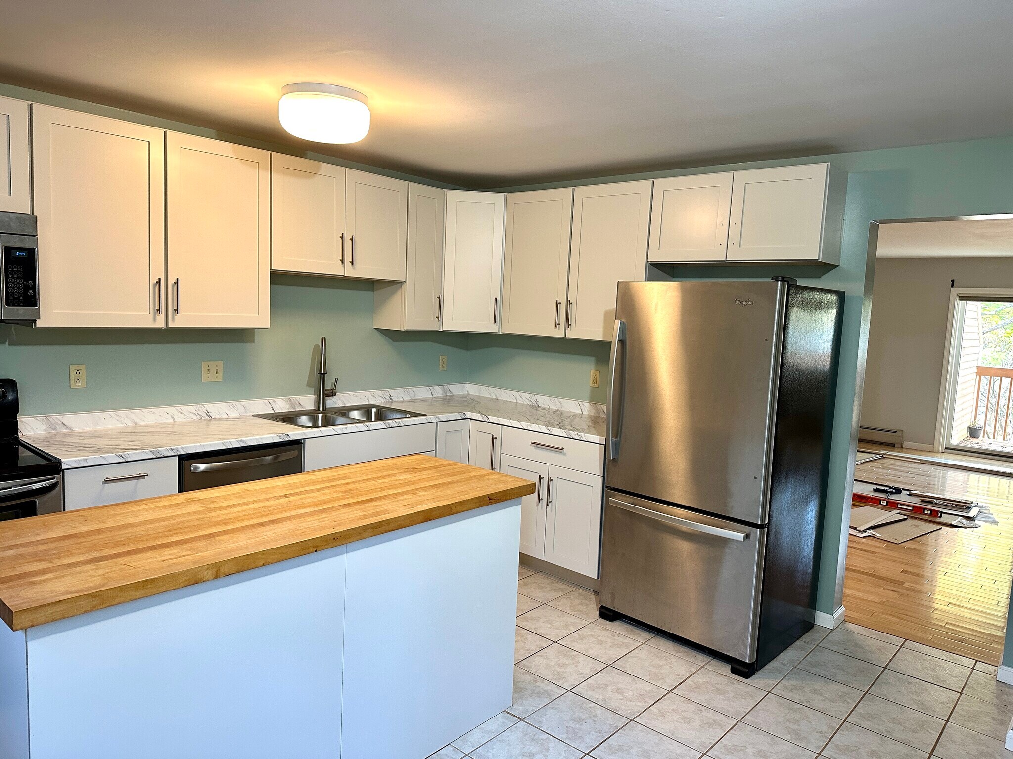 Kitchen looking into living room - M6 Stonehedge Dr