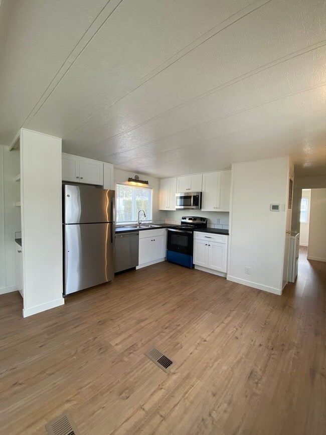 Building Photo - Beautifully just Remodeled-Spacious 3 bedrooms, 2 full baths mobile home with fenced yard. storag...