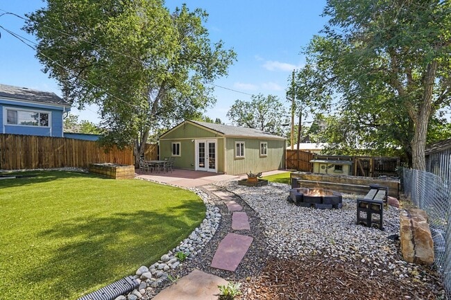 Building Photo - Spacious 4-Bedroom, 2-Bath Home with Large Yard, Garage & Central A/C