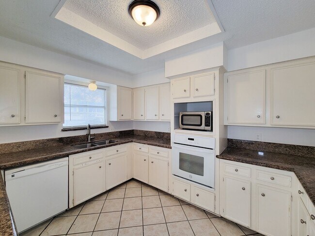 Building Photo - Come and view this open floor plan with much potential. Formal and dining room, granite counters,...