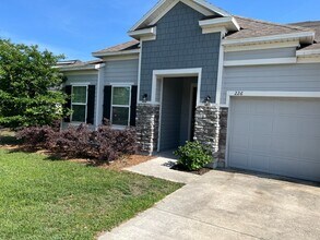 Building Photo - FOUR BEDROOMS and THREE BATHS For Rent