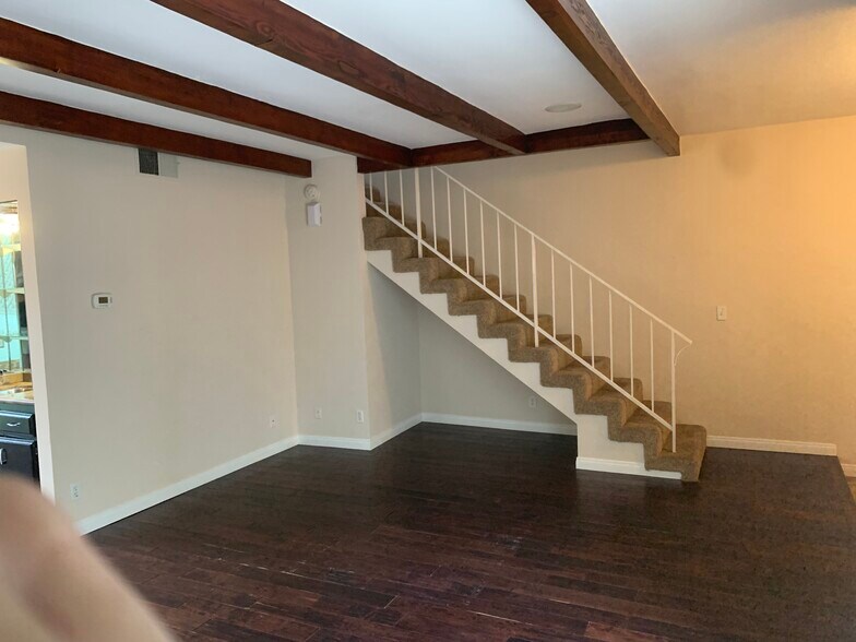 Living room and stairs to second level - 1232 Stanford St