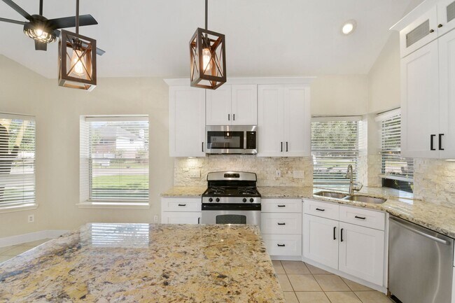 Building Photo - Remodeled & Ready: Bright, Functional Home...
