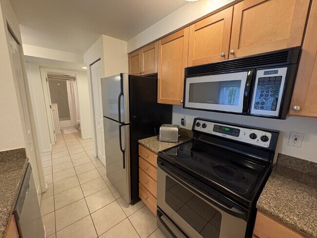 Building Photo - Bright, Modern 1BR Near Hospitals, SU & Transit in secure building with garage parking and a Walk...