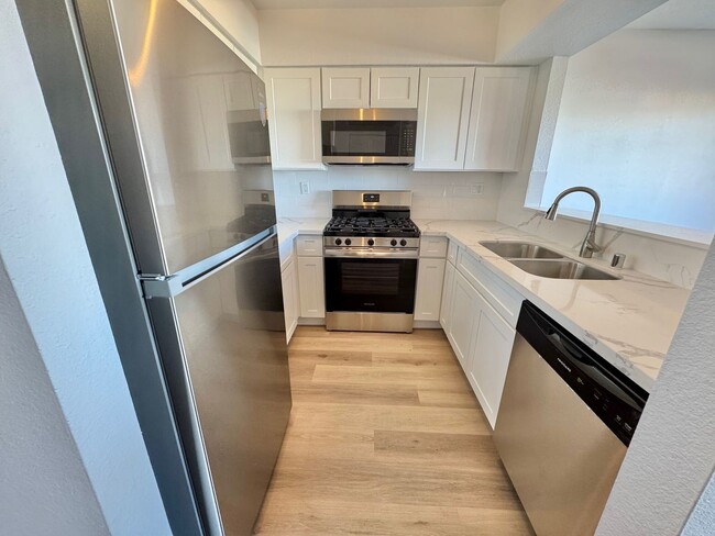 Building Photo - BRIGHT 2-BEDROOM CONDO NEAR STRIP & UNLV W/ PRIVATE BALCONY