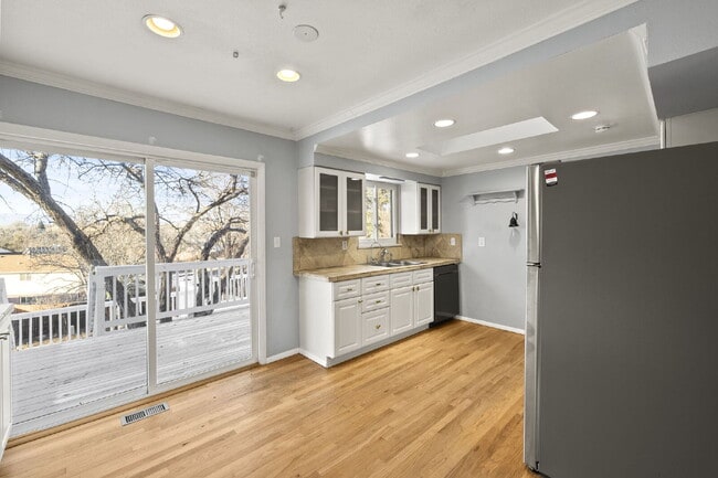 Building Photo - Spacious Split-Level Home with Beautiful Kitchen, Large Deck, and Fully Fenced Yard